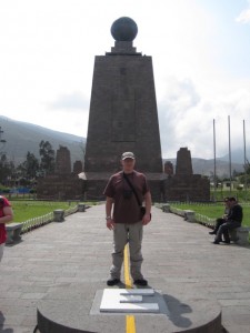 The Mitad del Mundo monument, and a tourist